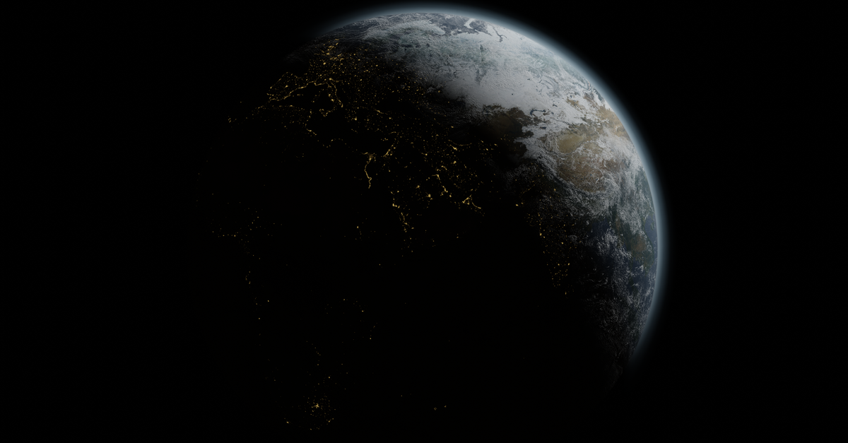 Planeta Terra visto do espaço à noite, com as luzes das cidades acesas na Europa e na África