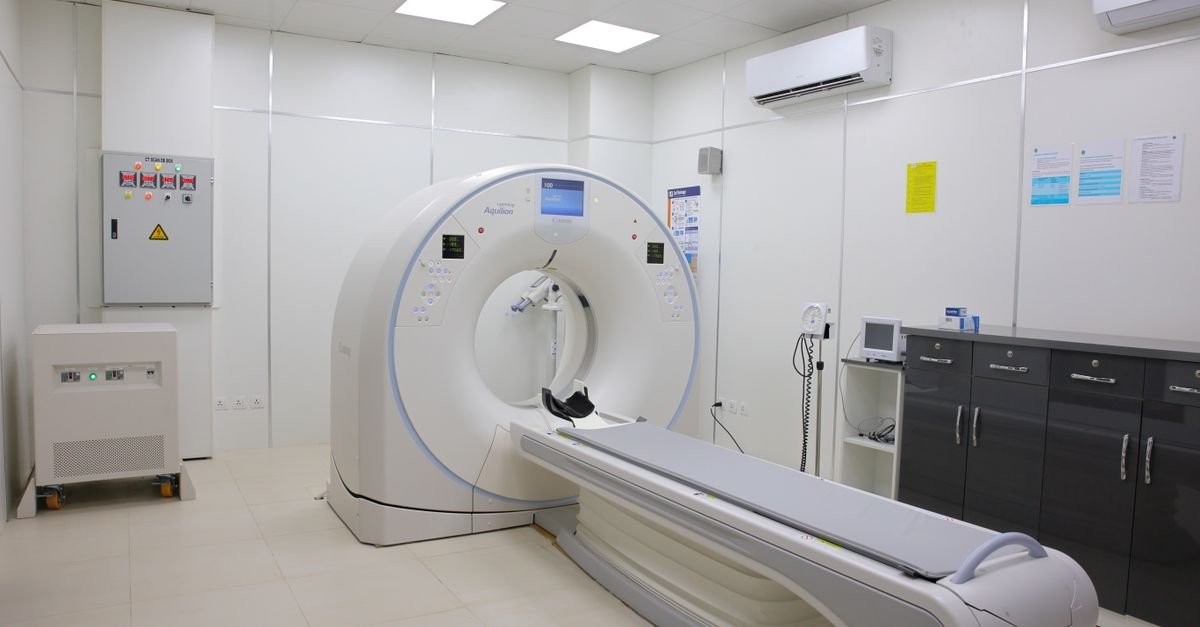 Bright and sterile hospital imaging room featuring a state-of-the-art CT scanner.