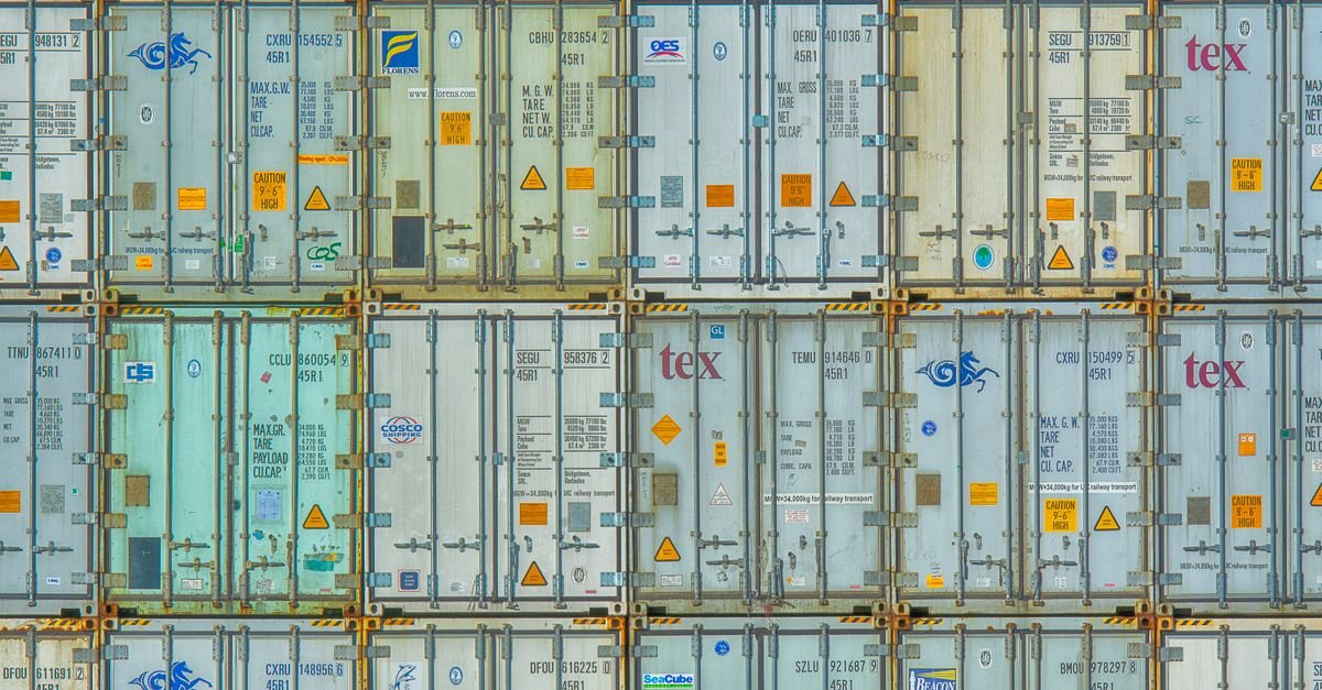 A vibrant display of stacked shipping containers, highlighting industrial organization.