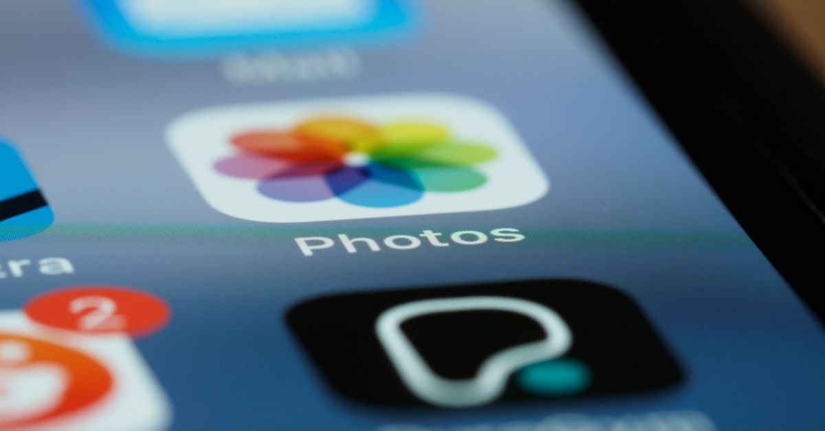 Detailed shot of smartphone screen showing app icons, including photos app.