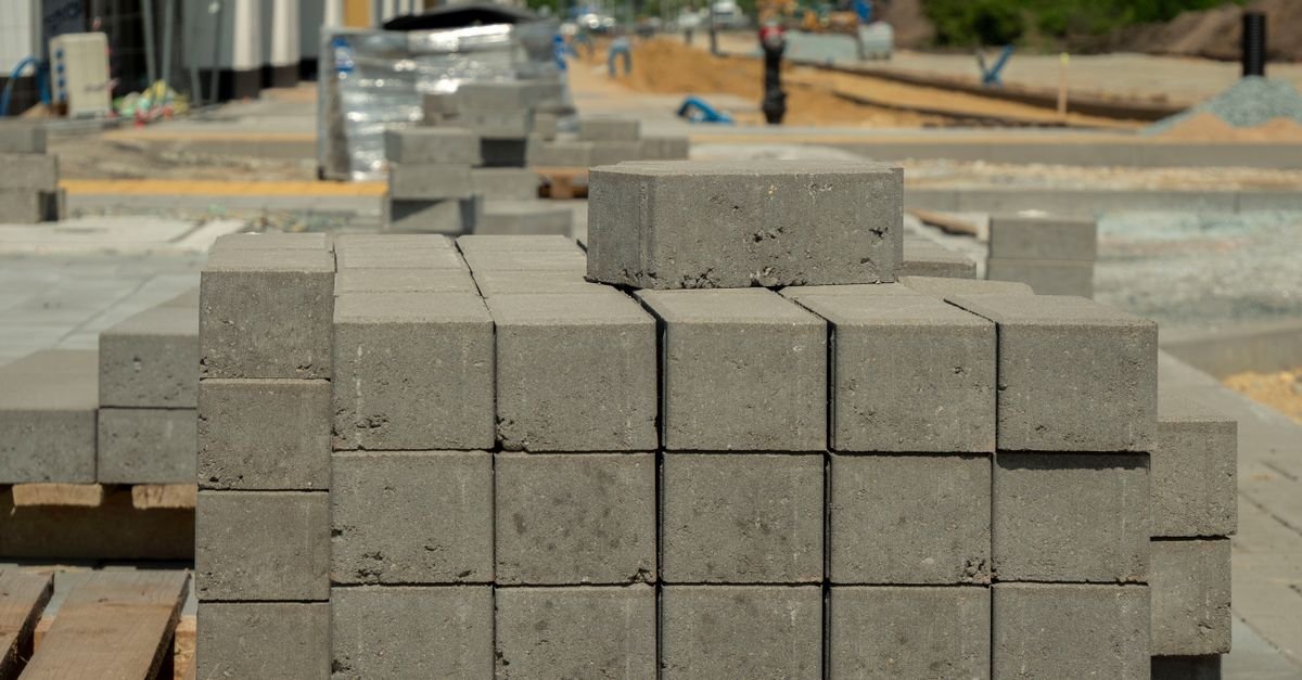 Concrete blocks stacked at a construction site in Wrocław, Poland, showcasing urban development.